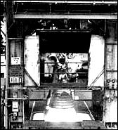 shown a 1963 test firing of an H-1 engine on a Rocketdyne test stand.