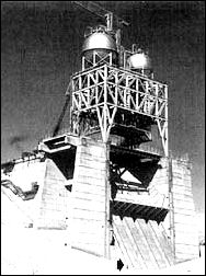 The F-1 test stand in the Mohave Desert towered 76 meters (note man at base).