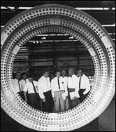 At the Marshall Space Flight Center (left), Dr. Wernher von Braun is flanked by the seven original astronauts as he explains details of rocket fabrication.