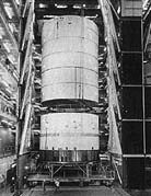 one of the early S-ll stages nears completion as the liquid hydrogen tank is lowered onto the liquid oxygen tank and their common bulkhead