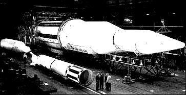 A 1959 version of Saturn I is shown at the right. Redstone and Jupiter tankage (left) were combined in Saturn I's first stage.