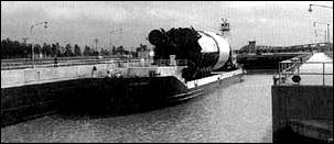 An S-IC stage is aboard the barge Pearl River at the Mississippi Test Facility.