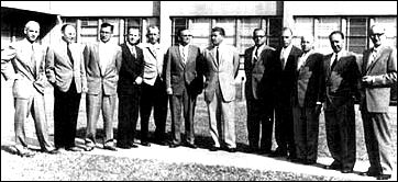 The heart of the <<von Braun team>> that led the Army's space efforts at ABMA before transfer to NASA: left to right: Dr. Ernst Stuhlinger, Director, Research Projects Office; Dr. Helmut Hoelzer, Director, Computation Laboratory; Karl L. Heimburg, Director, Test Laboratory; Dr. Ernst D. Geissler, Director, Aeroballistics Laboratory; Erich W. Neubert, Director, Systems Analysis and Reliability Laboratory; Dr. Walter Haeussermann, Director, Guidance and Control Laboratory; Dr. Wernher von Braun, Director, Development Operations Division; William A. Mrazek, Director, Structures and Mechanics Laboratory; Hans Hueter, Director, System Support Equipment Laboratory; Dr. Eberhard F. M. Rees, Deputy Director, Development Operations Division; Dr. Kurt Debus, Director, Missile Firing Laboratory; and H. H. Maus, Director Fabrication and Assembly Engineering Laboratory.