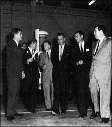 President Kennedy's visit to MSFC in September 1962 provided a forum for discussion of LOR: from the left, the President, MSFC Director Wernher von Braun, NASA Administrator James E. Webb, Vice-President Lyndon B. Johnson, Secretary of Defense Robert S. McNamara, and the President's Science Advisor Jerome B. Weisner.