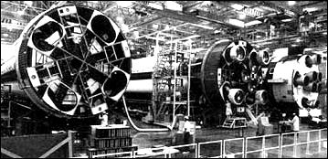 three Saturn IBs are in various stages of assembly at Michoud.