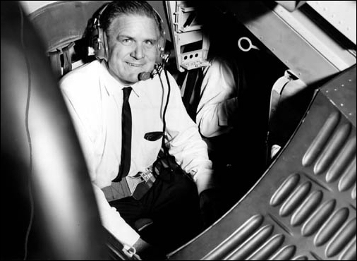NASA Administrator James E. Webb seated in the Gemini rendezvous and docking simulator during an August 7, 1965 visit to the Manned Spacecraft Center (renamed the Johnson Space Center in 1973). (NASA Photo S-65-28481.)