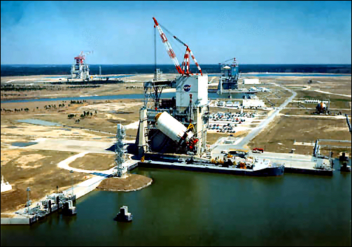The Apollo Saturn V Test Complex. In the foreground is the A-1 test stand with an S-II stage booster being hoisted into the stand in 1967