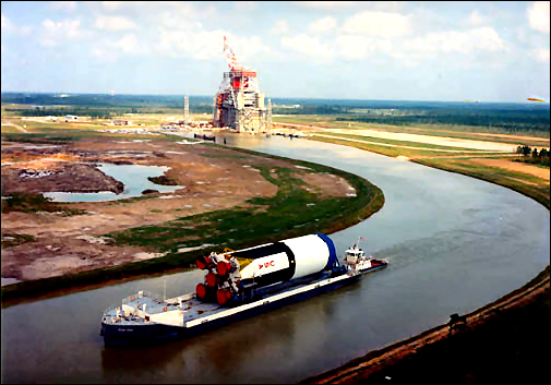 After testing is complete, the first stage booster of the Apollo Saturn V, the S-IC, leaves the test stand en route to the Kennedy Space Center in Florida. 