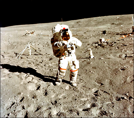 Astronaut John Young, commander of the Apollo 16 lunar landing mission, stands at the Apollo Lunar Surface Experiments Package (ALSEP) deployment site during the first EVA at the Descartes landing site.