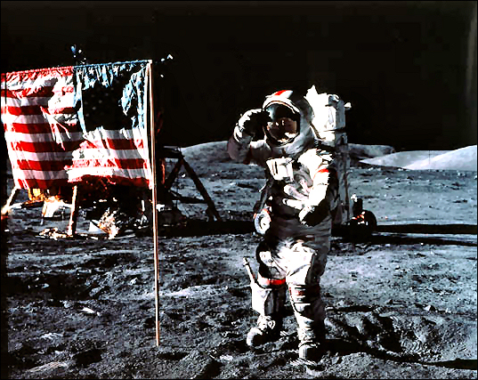 Astronaut Gene Cernan, Apollo 17 commander, salutes the deployed United States flag on the lunar surface.