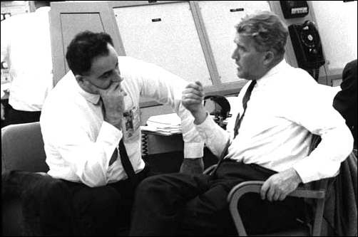 Wernher von Braun and Rocco Petrone, director of launch operations, talk during a lull in the preparations of a Saturn I vehicle launch at Cape Kennedy's Launch complex 37 Control Center on May 25, 1965